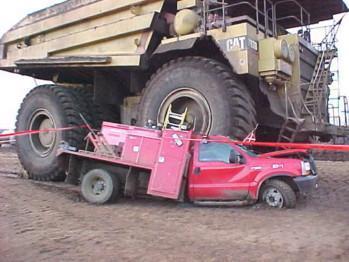 dump-truck-driving-over-pickup