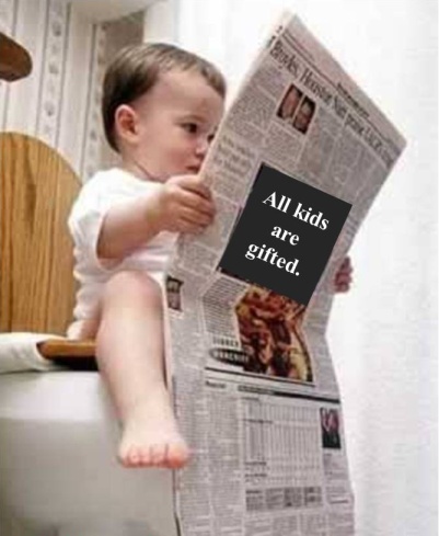 kid reading newspaper on toilet
