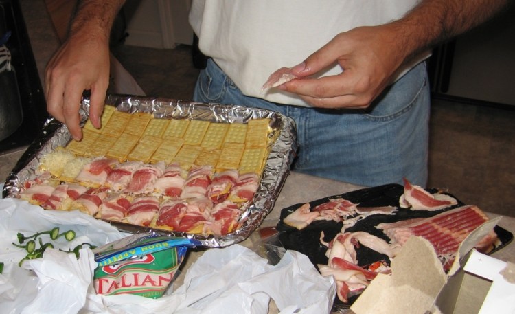 bacon-wrapped club crackers, with cheese, in preparation