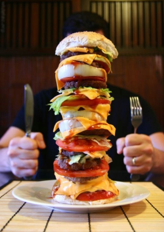 burger stacked with various items