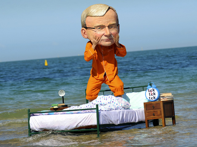 man in costume on bed in ocean