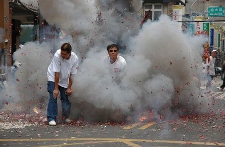 guys with smoke all around guys standing in smoke of firecrackers